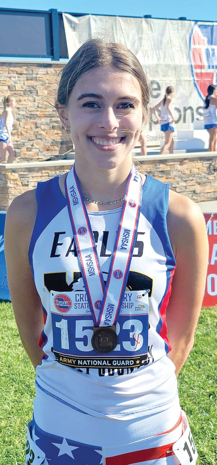 Hartville’s Clemmie Taylor with her All-State medal from the Class 2 girls state championship race held in Columbia.